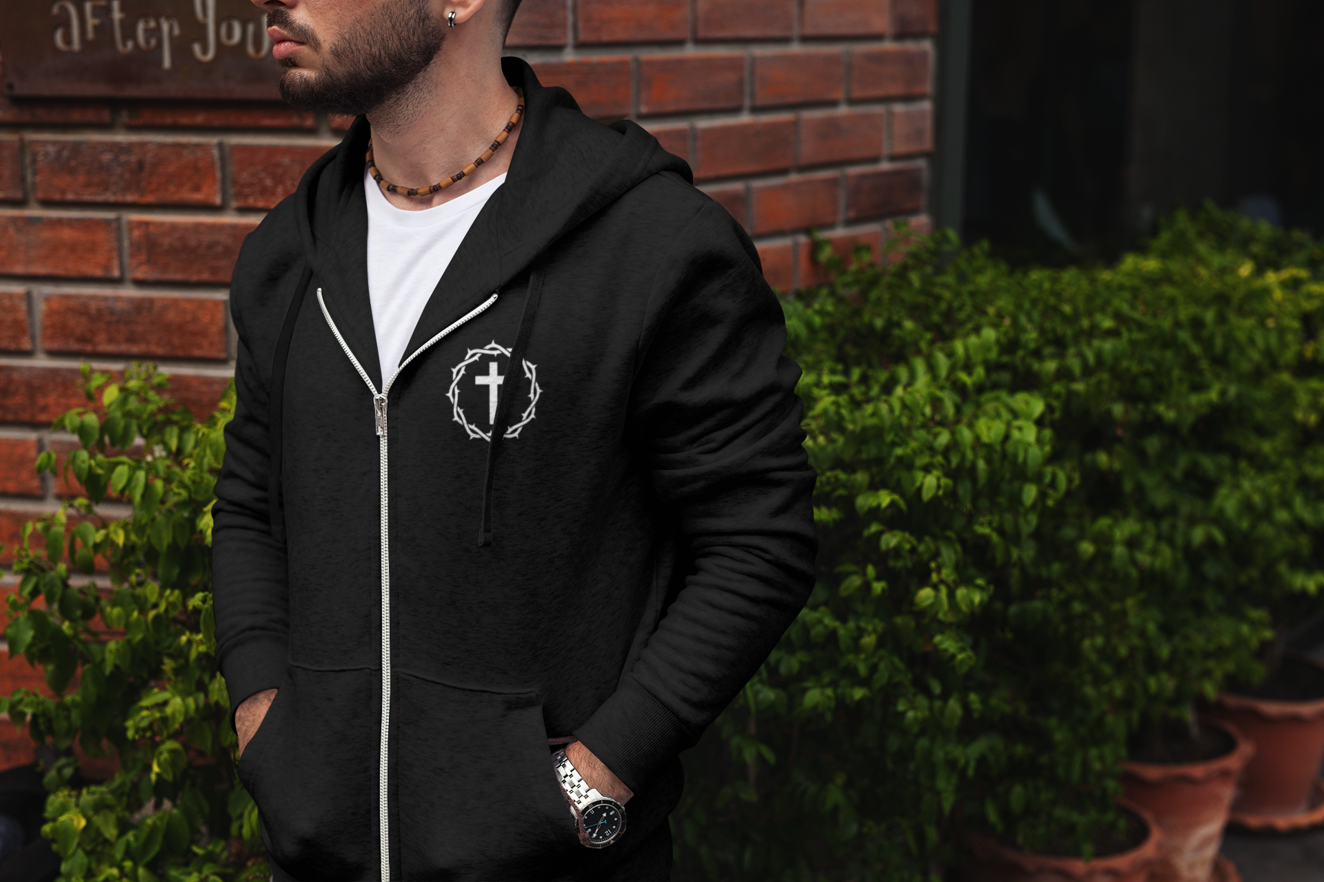 Image of Man wearing a black zip one way hoodie.