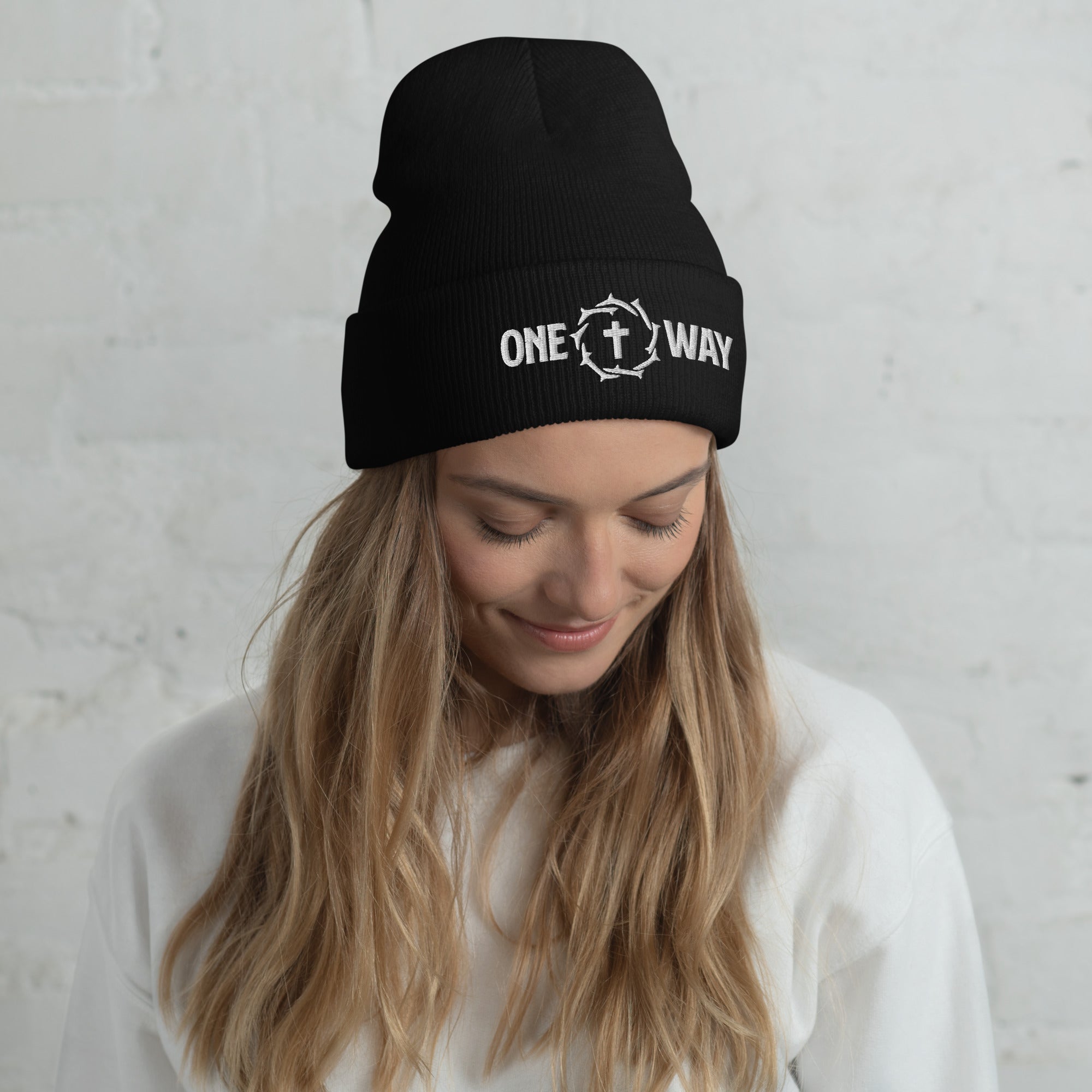 Image of Woman wearing the One Way embroidered cuffed beanie in black