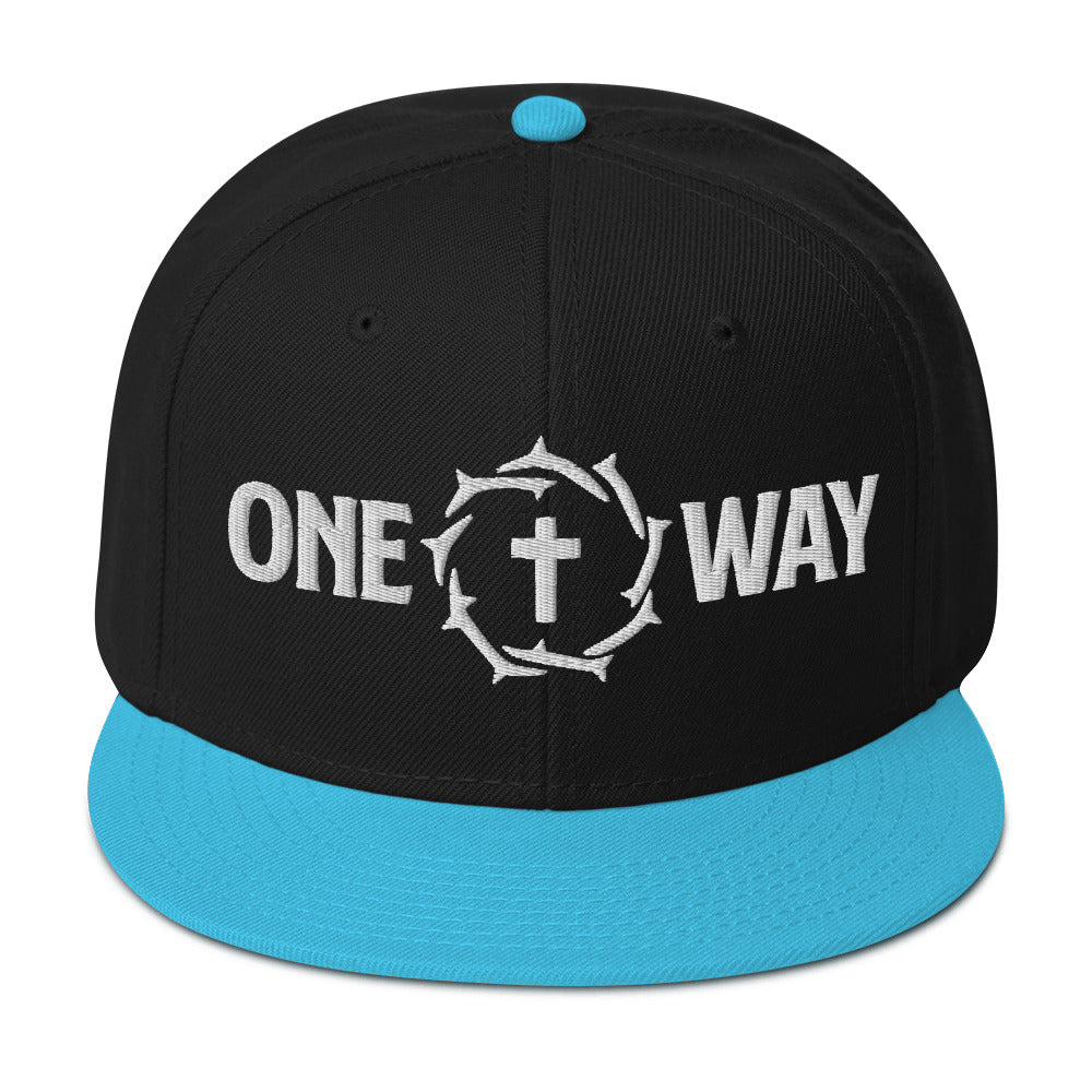 Image of One Way embroidered snapback hat in black with aqua blue visor, showing the cross and crown of thorns design, front view