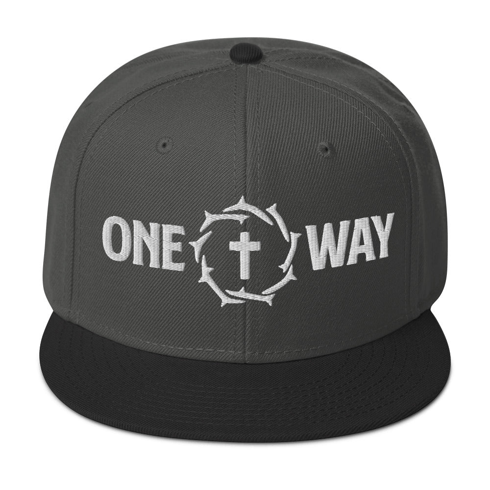 Image of One Way embroidered snapback hat in charcoal gray with black visor, showing the cross and crown of thorns design, front view