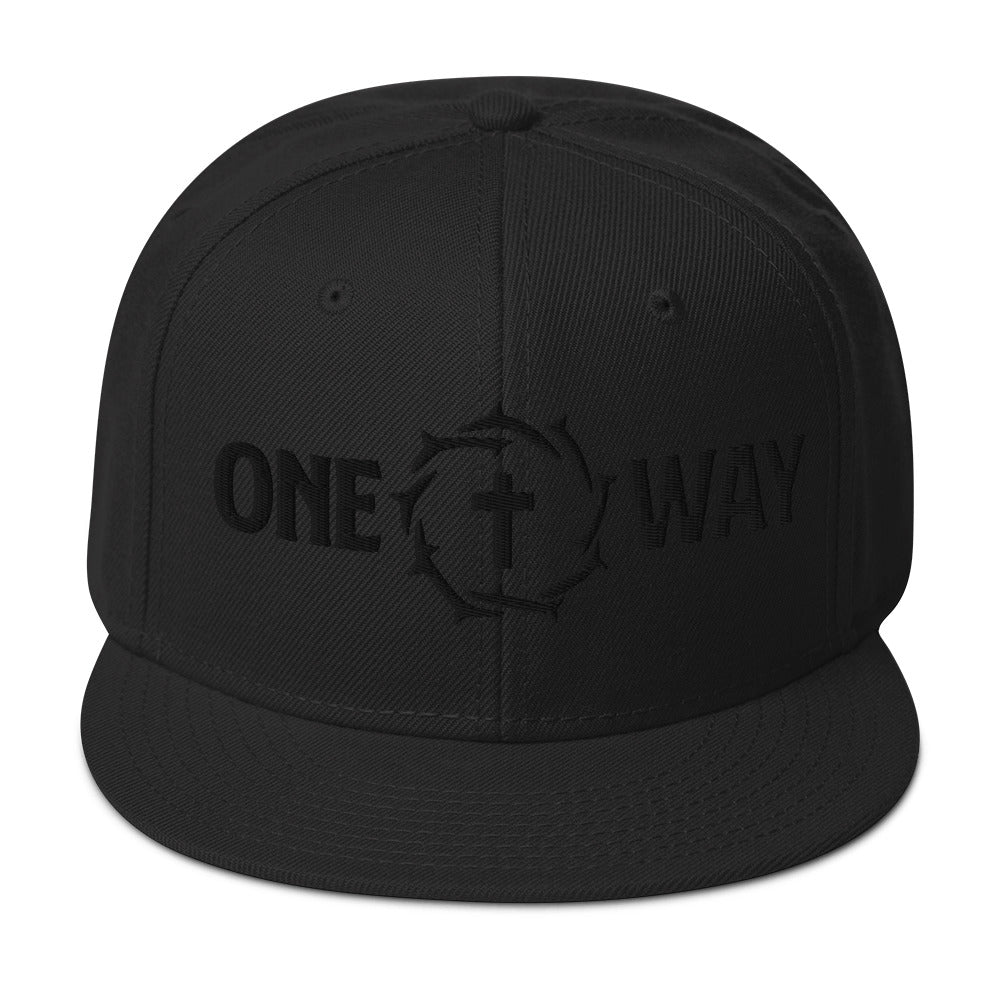 Image of One Way black-on-black snapback hat with cross and crown of thorns design, front view