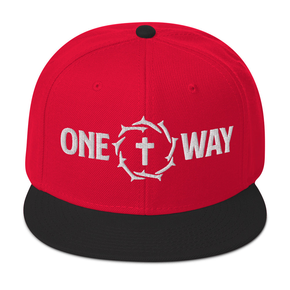 Image of One Way embroidered snapback hat in red with black visor, showing the cross and crown of thorns design, front view