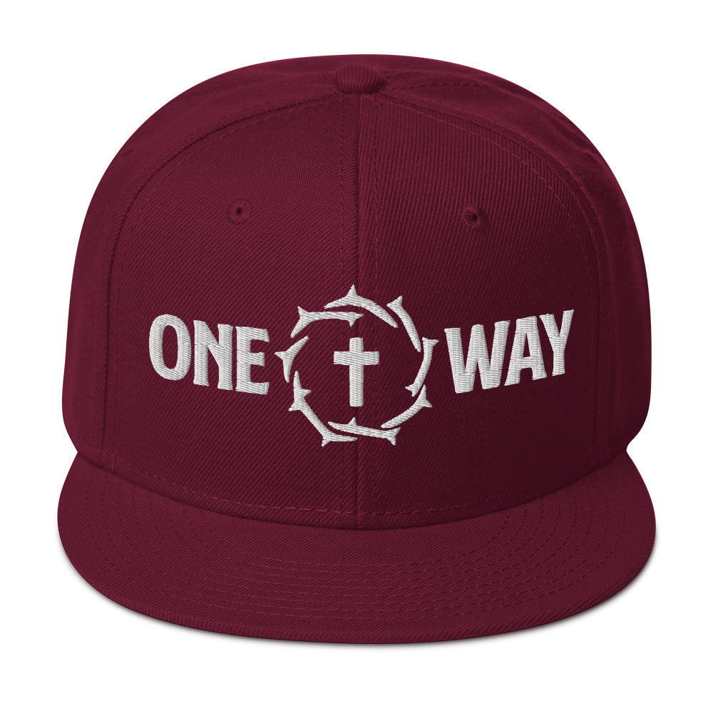 One Way embroidered snapback hat in burgundy with cross and crown of thorns design, front view
