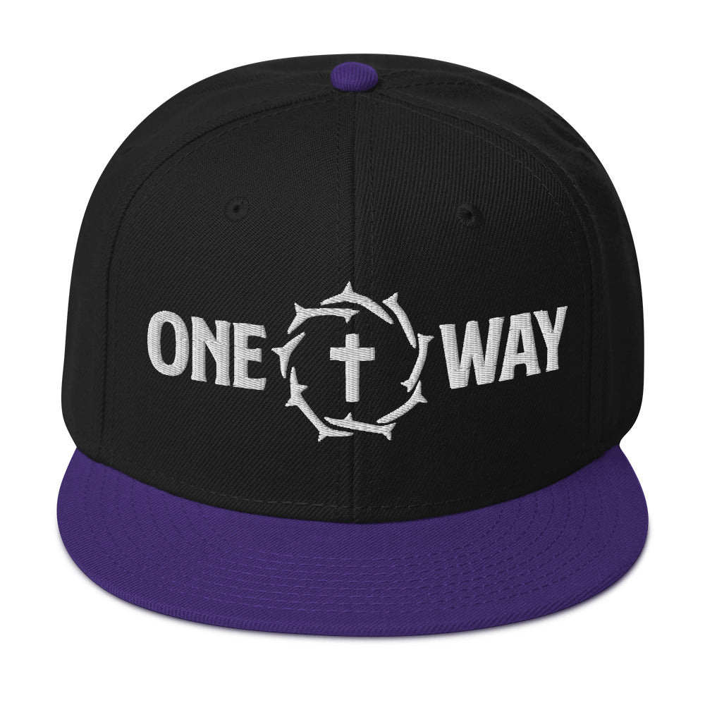 Image of One Way embroidered snapback hat in black with purple visor, showing the cross and crown of thorns design, front view