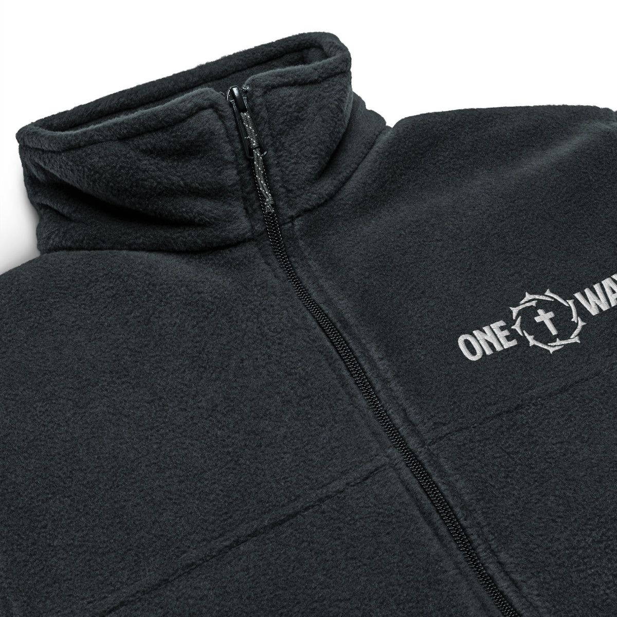 Close-up of the embroidered ONE WAY cross and crown of thorns, zipper and fleece collar on the black Columbia jacket