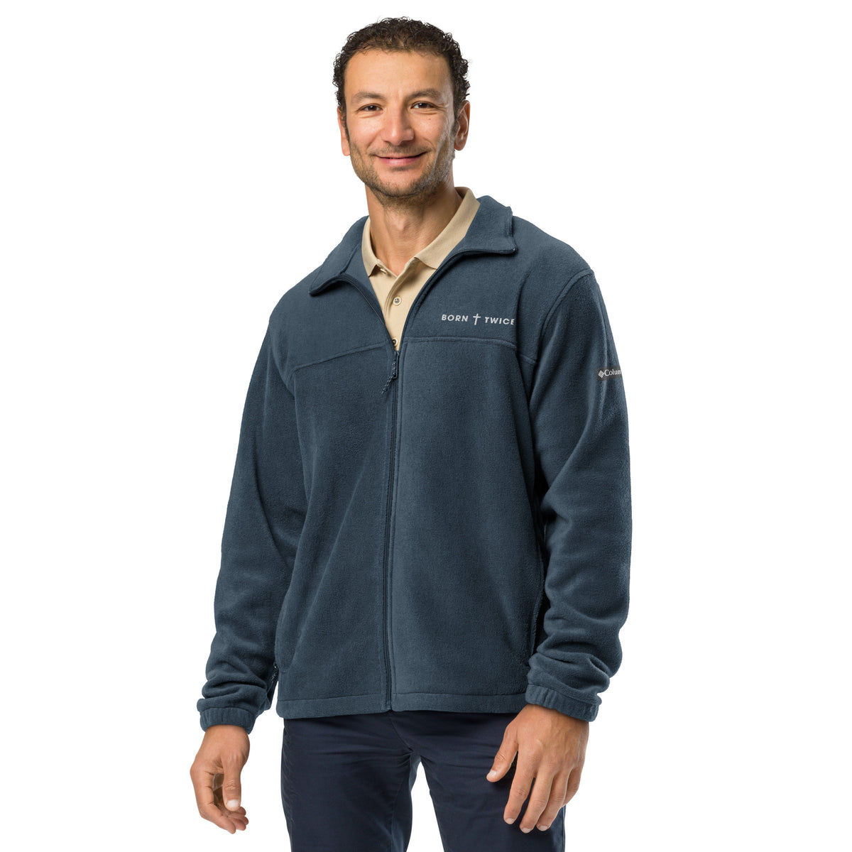 Smiling man in the Born Twice Columbia fleece jacket in collegiate navy over a tan polo, front view with the chest embroidery