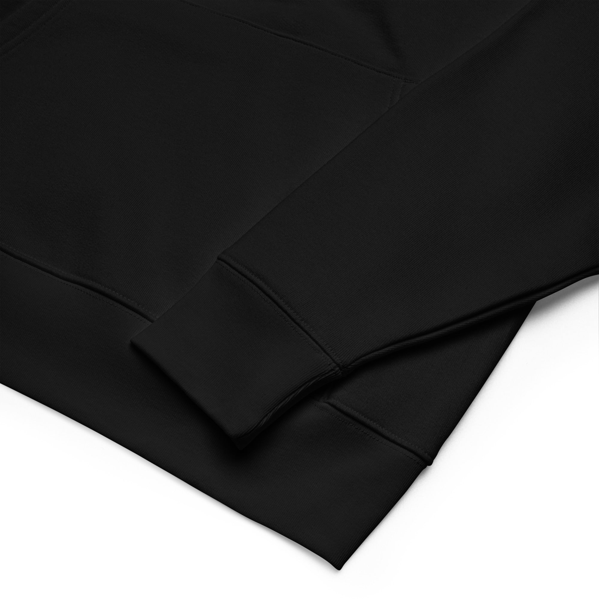Image of Close-up of the ribbed cuff and pocket on the One Way embroidered essential hoodie in black