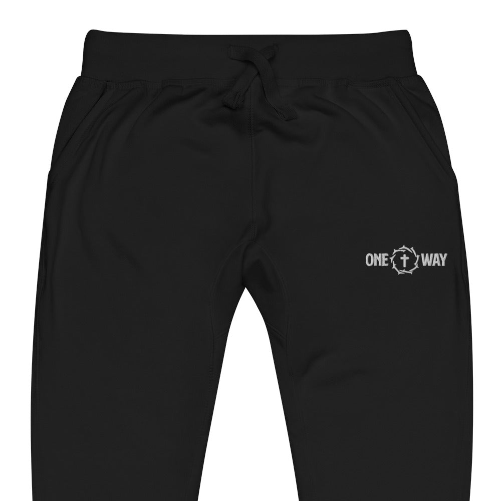 Close-up of the waistband, drawstring and logo on the One Way fleece sweatpants in black