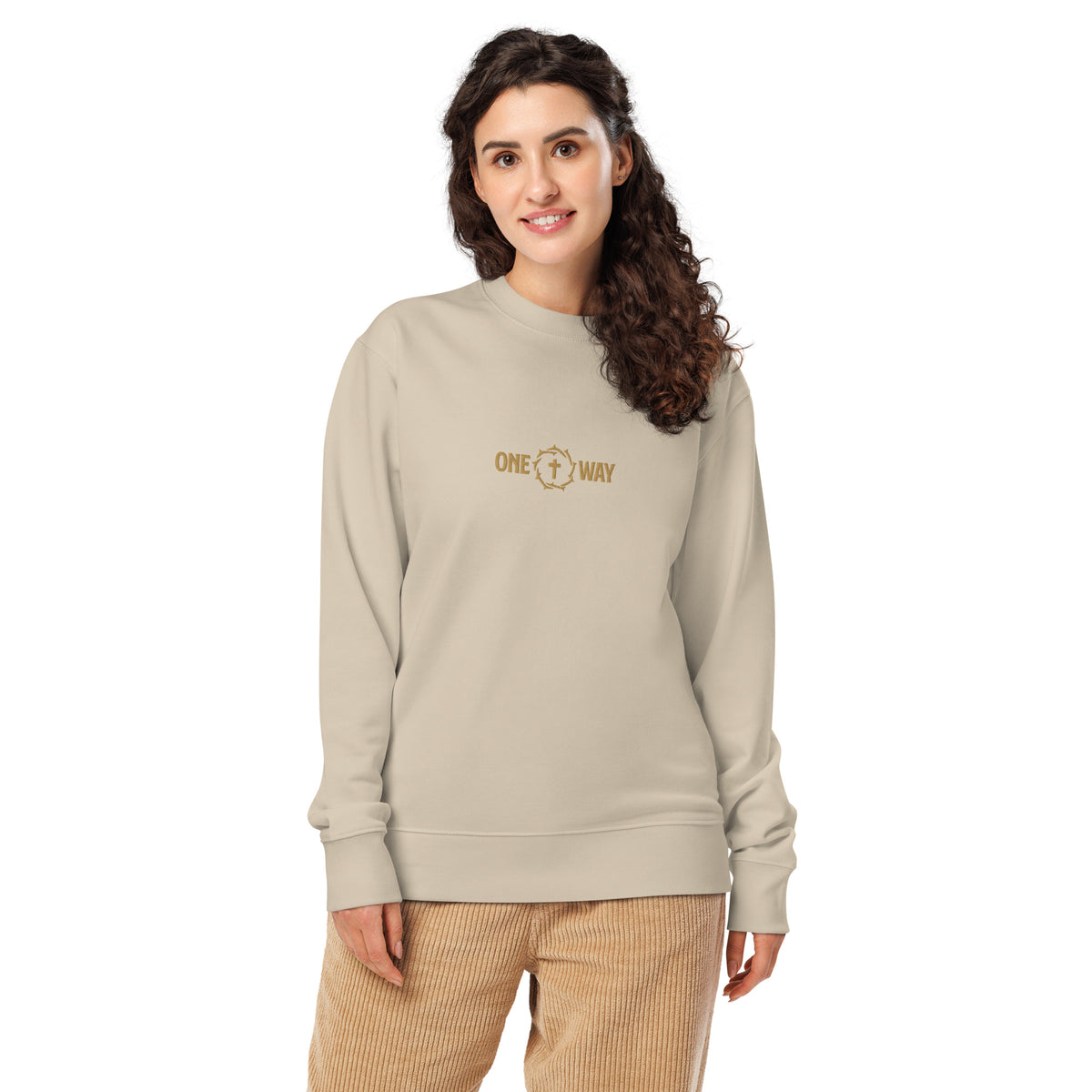 Woman wearing the One Way embroidered sweatshirt in desert dust with cross and crown of thorns design