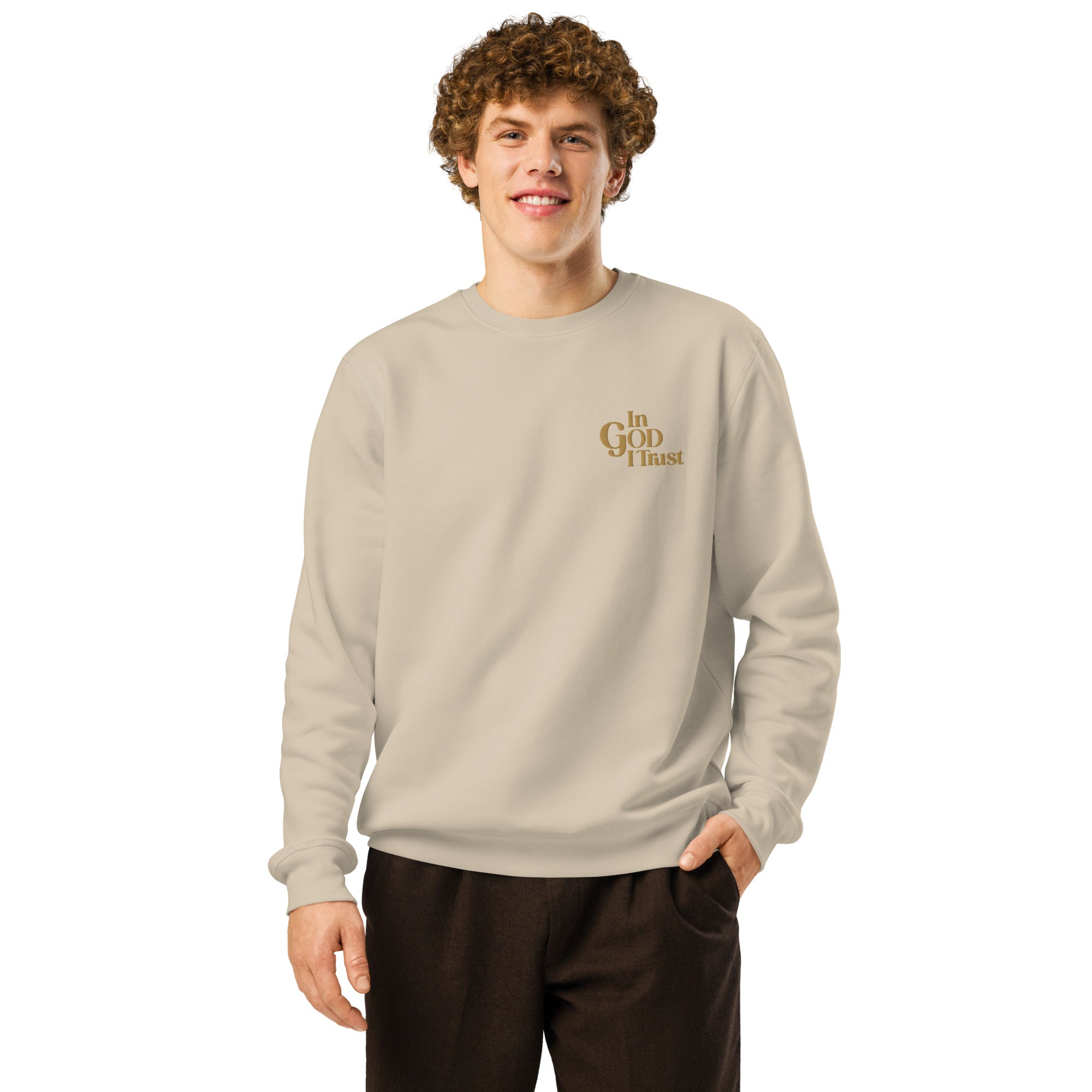 Image of Man wearing the Desert Dust sweatshirt with small gold In GOD I Trust embroidery on the left chest