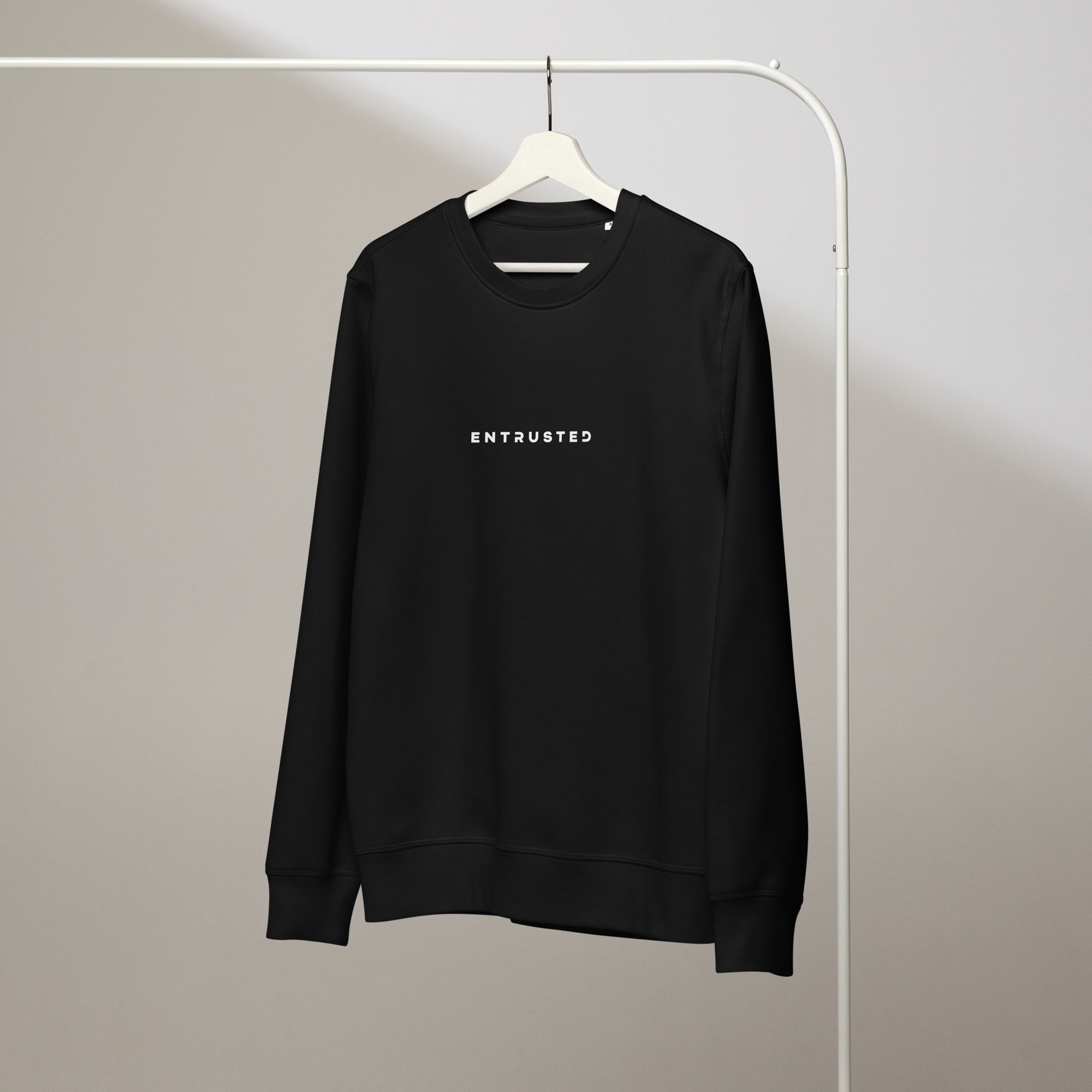 Image of Entrusted Christian sweatshirt black front detail — Entrusted to Him