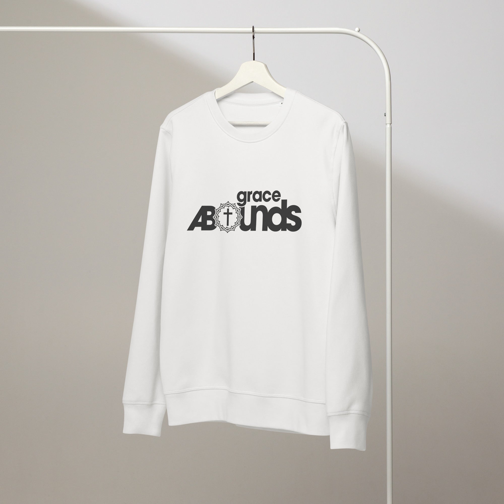 Image of Grace Abounds Christian sweatshirt white front close-up — Entrusted to Him faith apparel