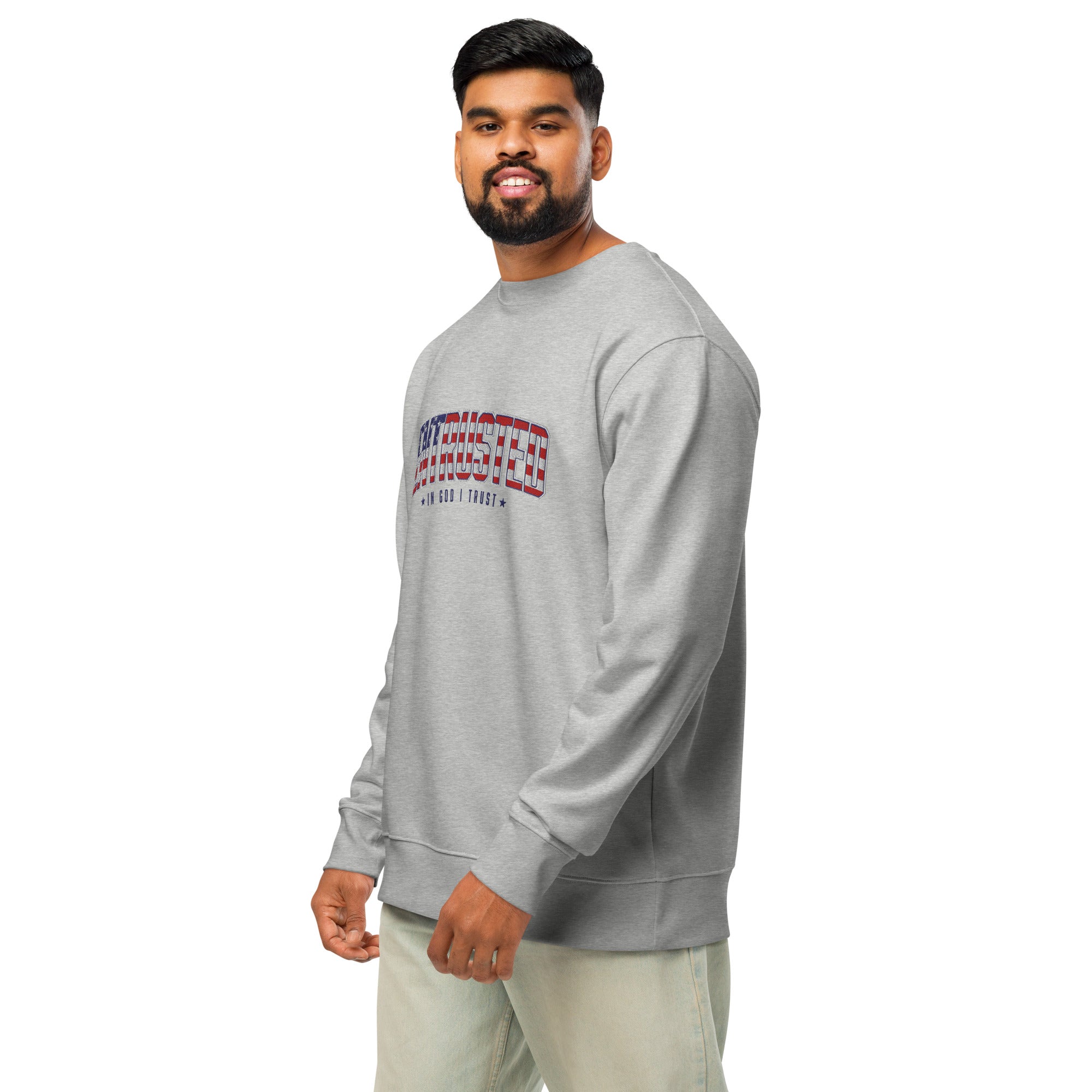 Image of Man in the Heather Grey patriotic sweatshirt turned three-quarters, showing the flag ENTRUSTED design on the chest