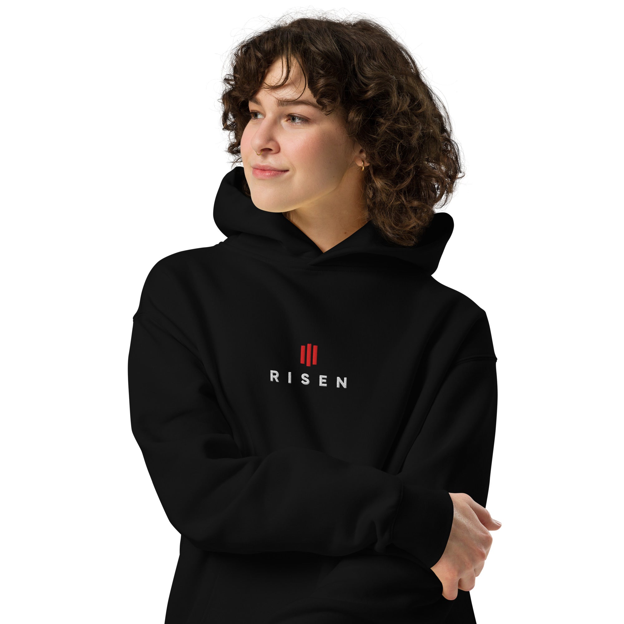 Image of Risen oversized faith-based hoodie black front styled — Entrusted to Him