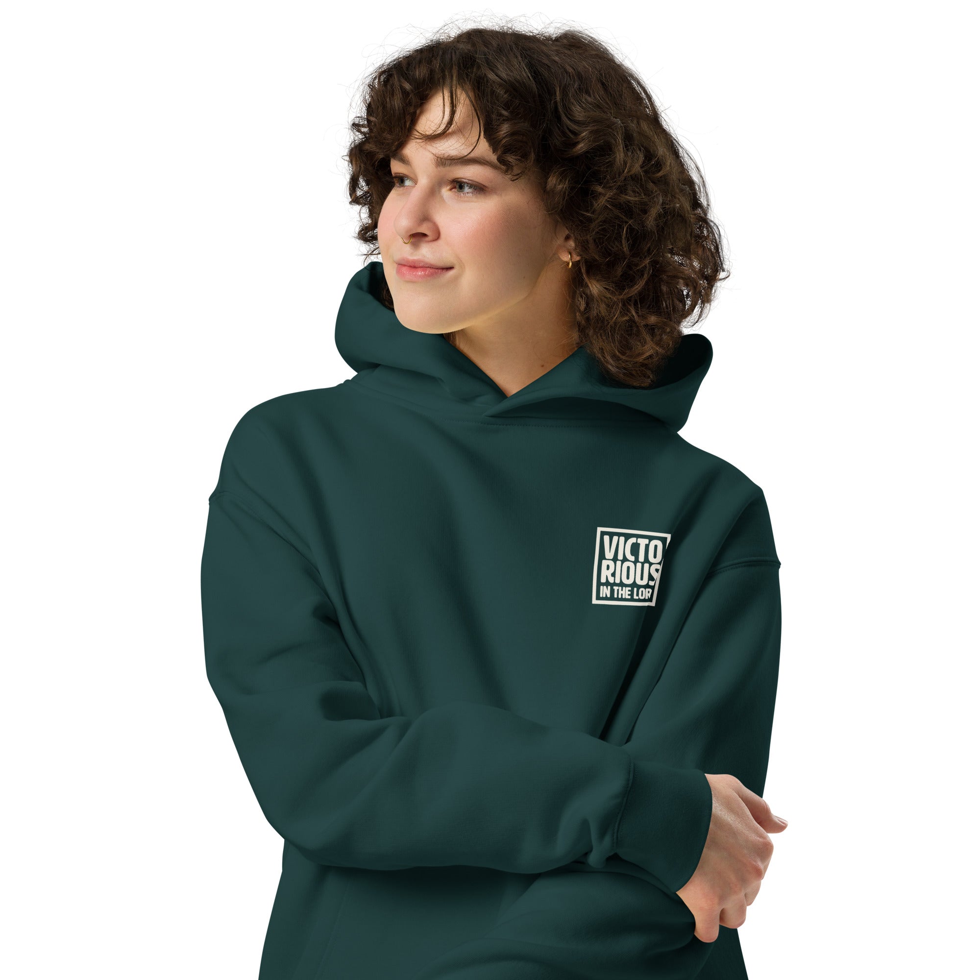 Image of Victorious in the Lord pine green faith hoodie lifestyle front — Jesus hoodie oversized Christian apparel